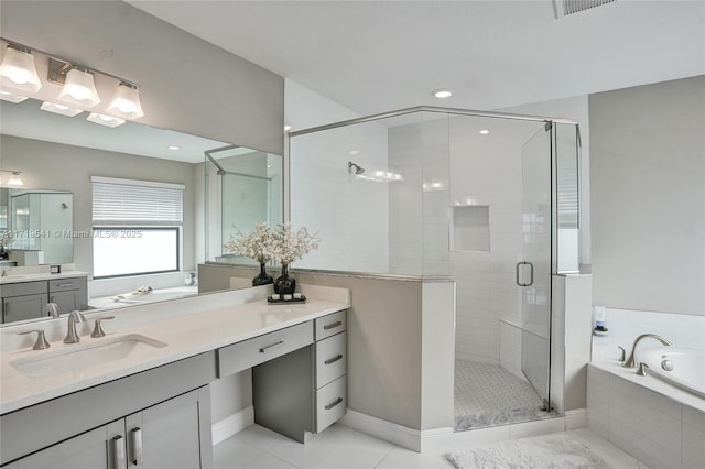 bathroom with vanity, tile patterned floors, and separate shower and tub