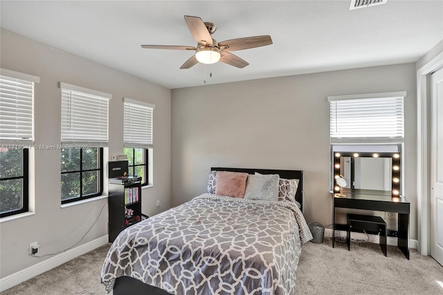 bedroom with light carpet and ceiling fan