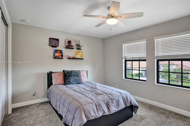 bedroom featuring light colored carpet and ceiling fan