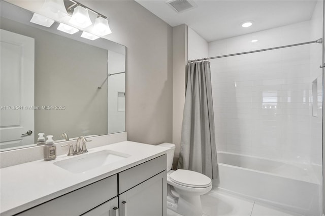 full bathroom with tile patterned flooring, shower / tub combo, vanity, and toilet