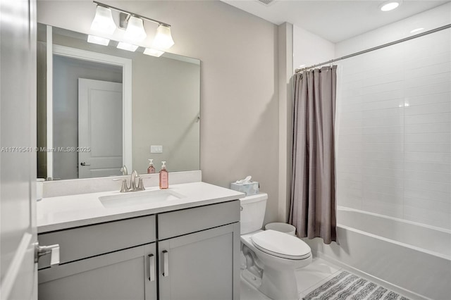 full bathroom with vanity, toilet, and shower / tub combo with curtain