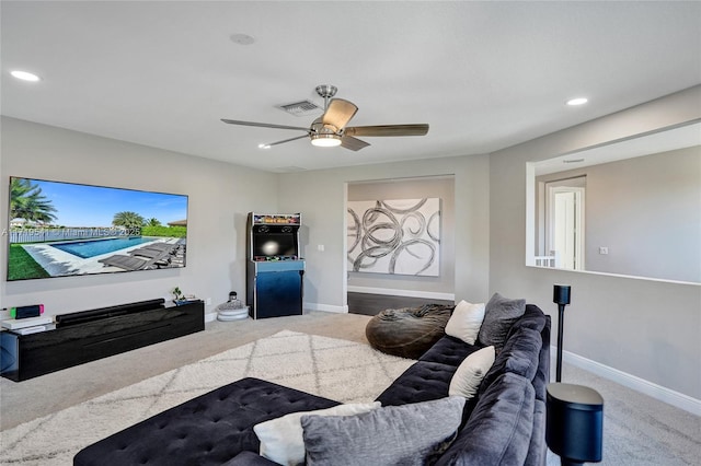 living room with ceiling fan and carpet floors