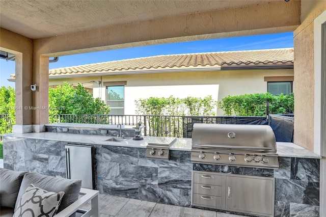 view of patio / terrace with area for grilling, sink, and grilling area