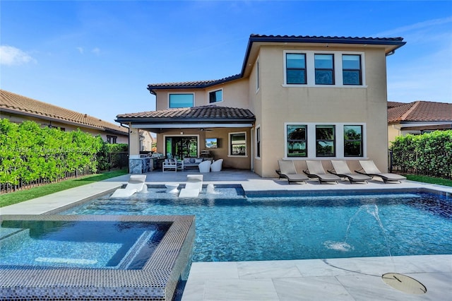 rear view of property with pool water feature, a swimming pool with hot tub, and ceiling fan