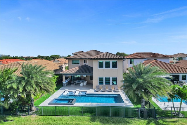 view of pool featuring outdoor lounge area, a patio, an in ground hot tub, and a lawn