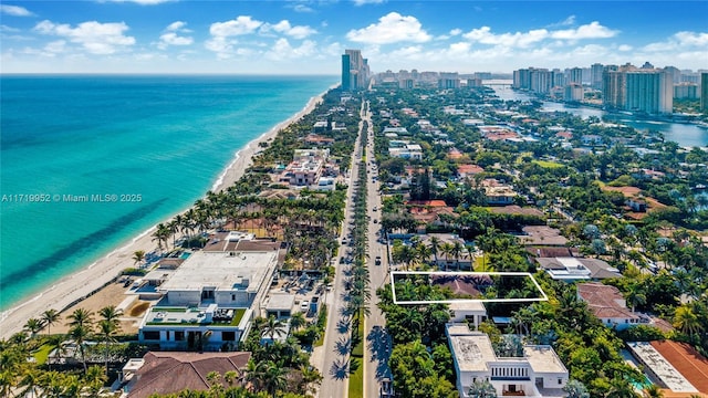 aerial view featuring a water view and a view of the beach