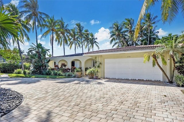 view of front of property with a garage