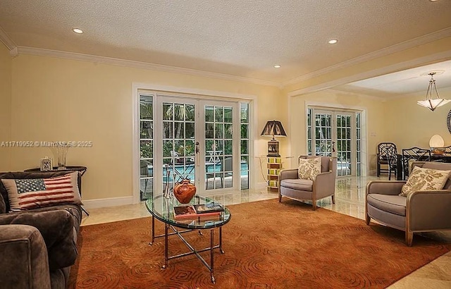 living room with a textured ceiling, ornamental molding, and french doors