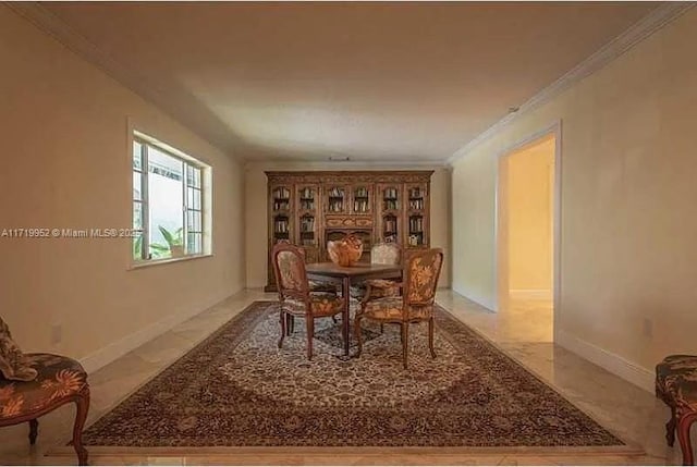 dining room featuring crown molding