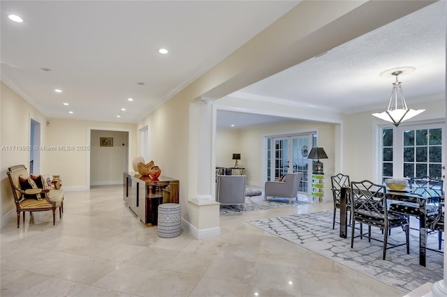 interior space featuring crown molding and french doors