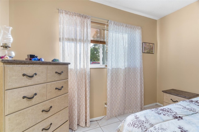 bedroom with light tile patterned floors