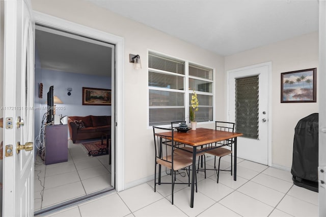 dining room with light tile patterned flooring