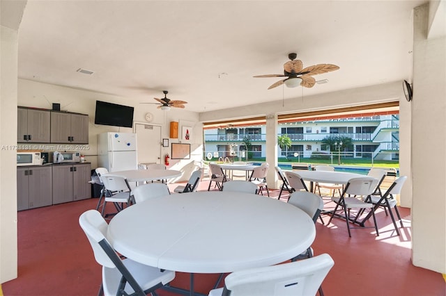 dining space featuring ceiling fan