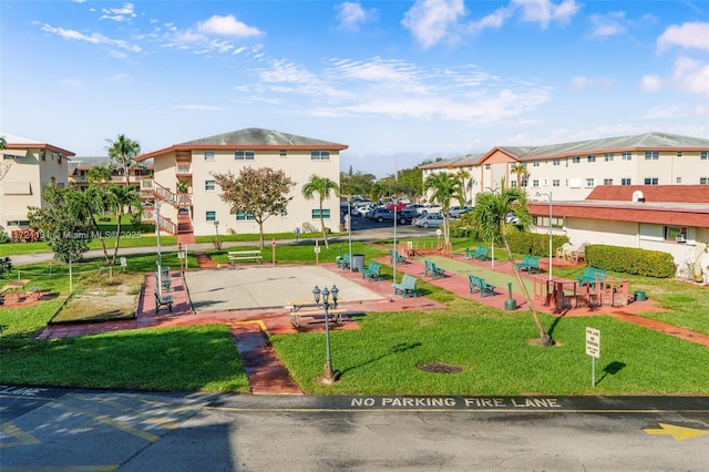 view of home's community with a lawn