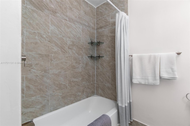 bathroom with shower / tub combo with curtain