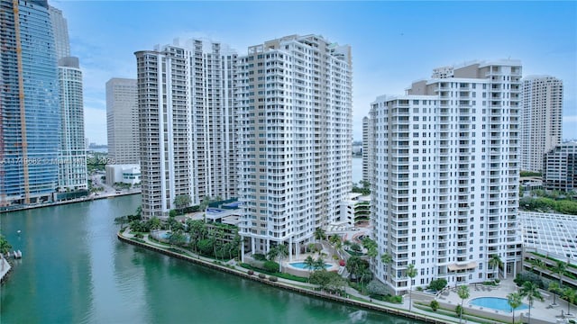 birds eye view of property featuring a view of city and a water view