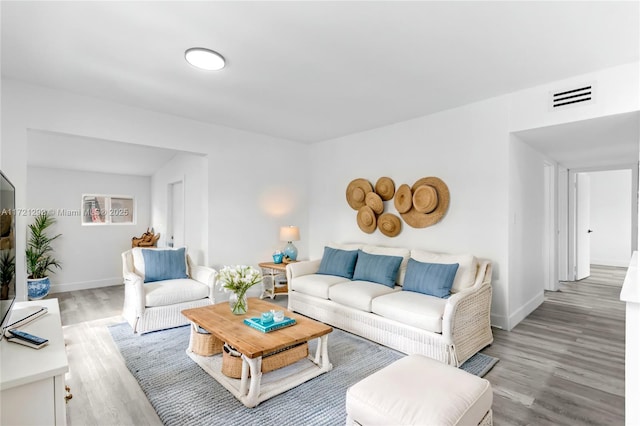 living room with light hardwood / wood-style floors