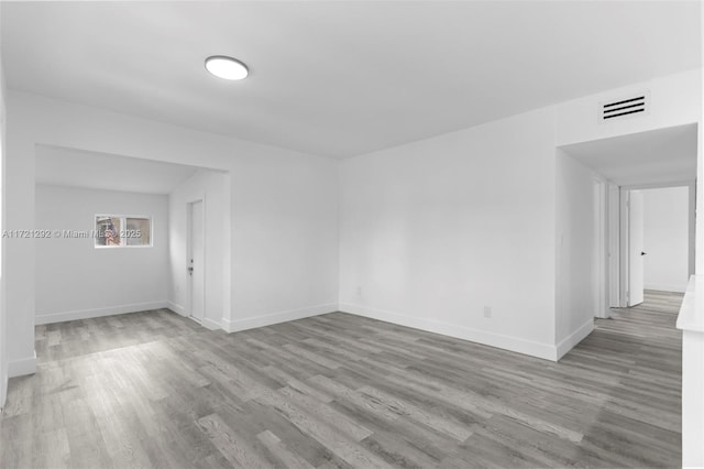 spare room featuring light hardwood / wood-style flooring