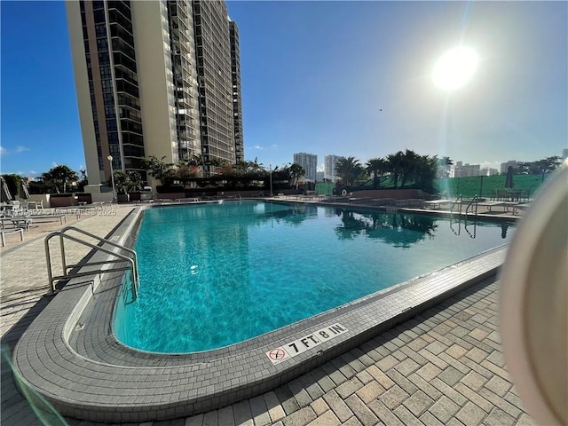 view of swimming pool with a patio