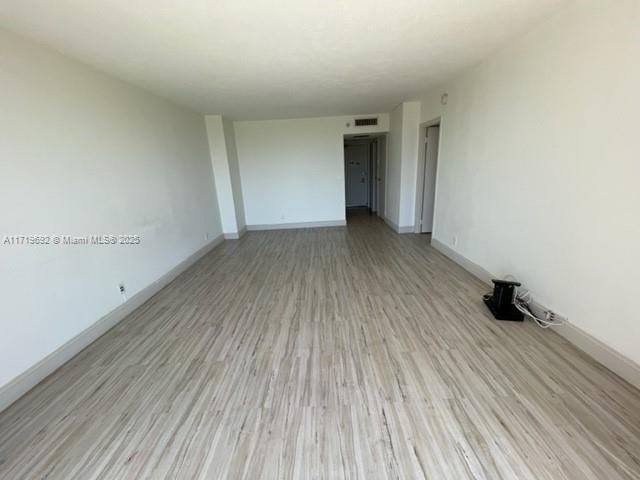 unfurnished room featuring light hardwood / wood-style flooring