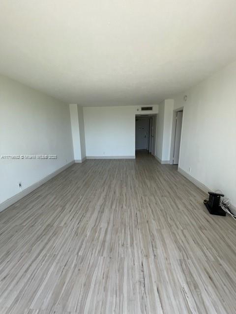 unfurnished living room featuring light hardwood / wood-style floors