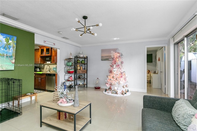 living room with a chandelier, light tile patterned floors, a textured ceiling, and crown molding