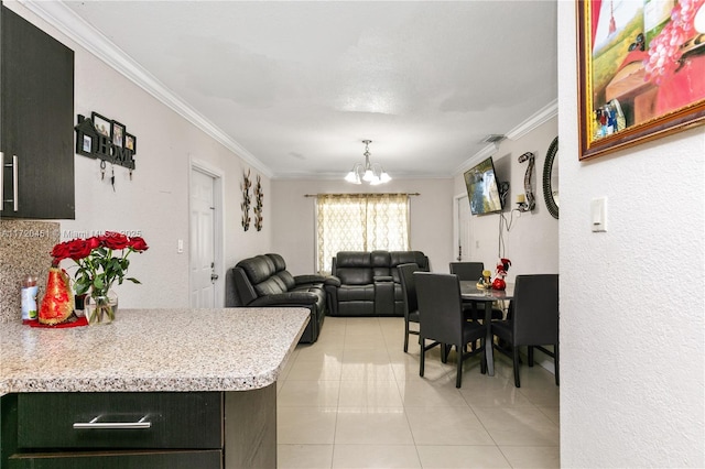 tiled dining room with ornamental molding and a notable chandelier