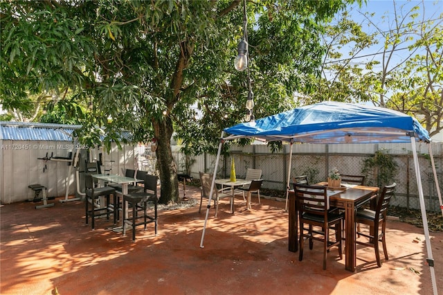 view of patio / terrace with a storage shed