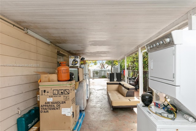 view of patio with stacked washer / drying machine