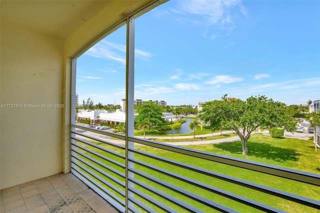 balcony featuring a water view