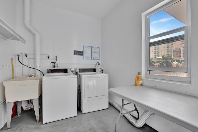 laundry room featuring sink and washing machine and clothes dryer