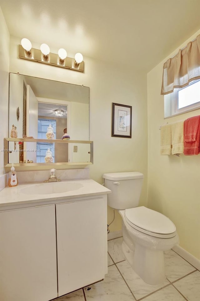 bathroom with vanity and toilet