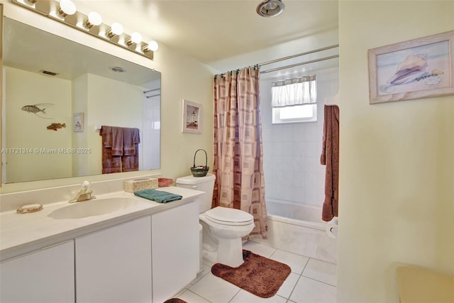 full bathroom featuring tile patterned flooring, vanity, toilet, and shower / tub combo with curtain