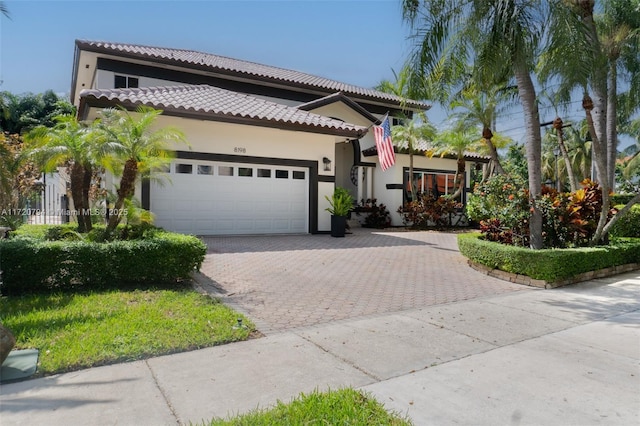 view of front of property with a garage