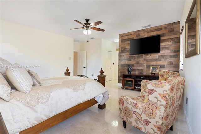 bedroom featuring ceiling fan and a closet