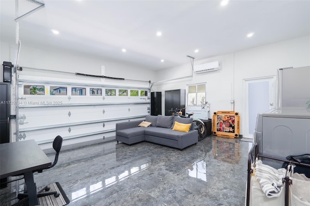 living room featuring a wall mounted air conditioner and washer / clothes dryer