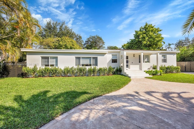 single story home featuring a front yard and a porch