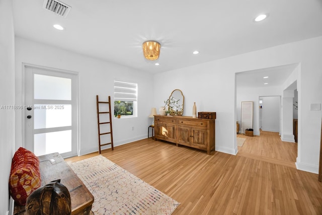 sitting room featuring light hardwood / wood-style floors