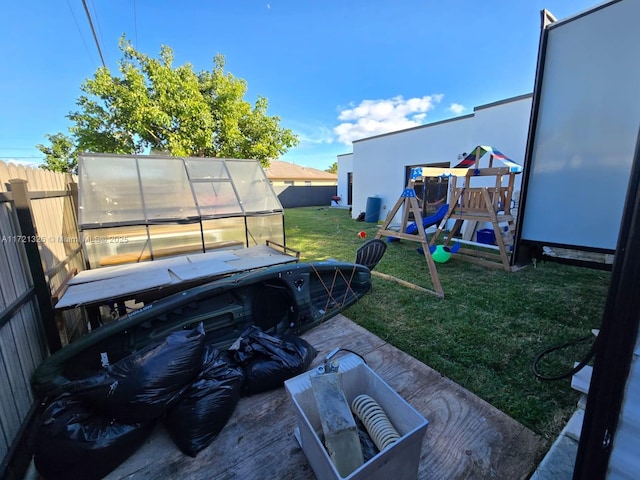 view of yard featuring an outbuilding and a playground