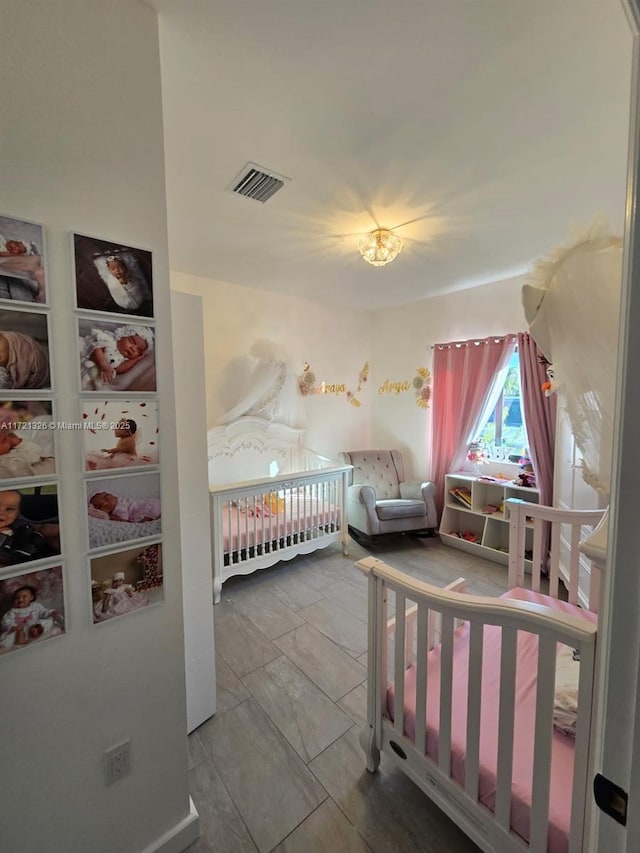 bedroom featuring a crib