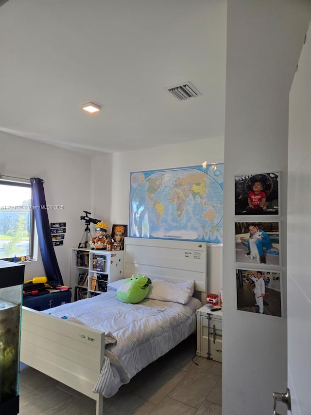 bedroom with tile patterned floors