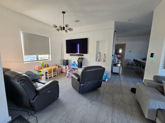 living room with a notable chandelier