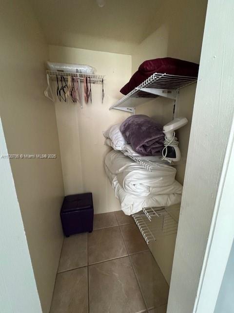 spacious closet with tile patterned flooring