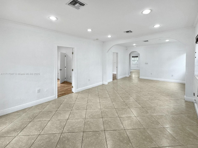 tiled empty room with ornamental molding