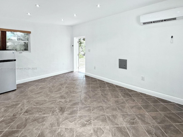 tiled empty room featuring an AC wall unit