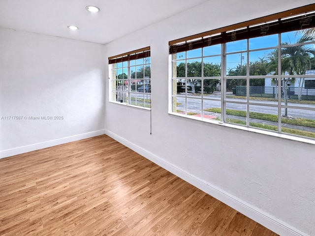 empty room featuring hardwood / wood-style flooring