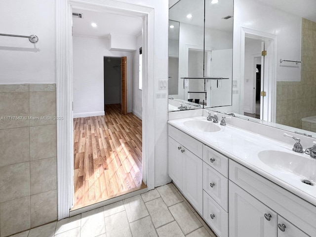 bathroom featuring tile patterned flooring and vanity