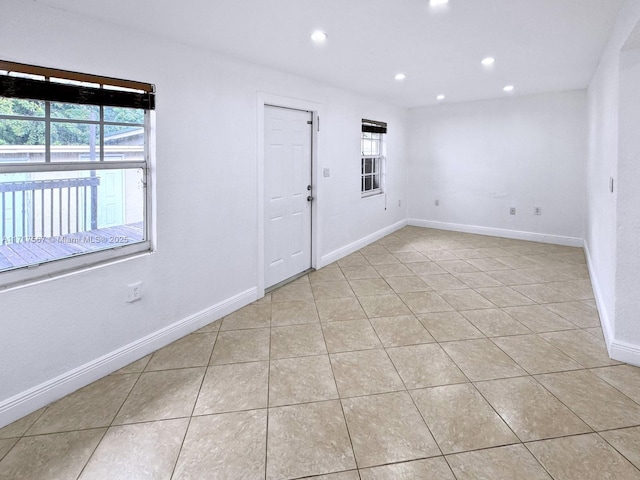 unfurnished room featuring light tile patterned floors