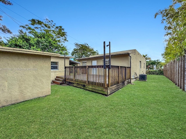 view of yard featuring a deck and cooling unit