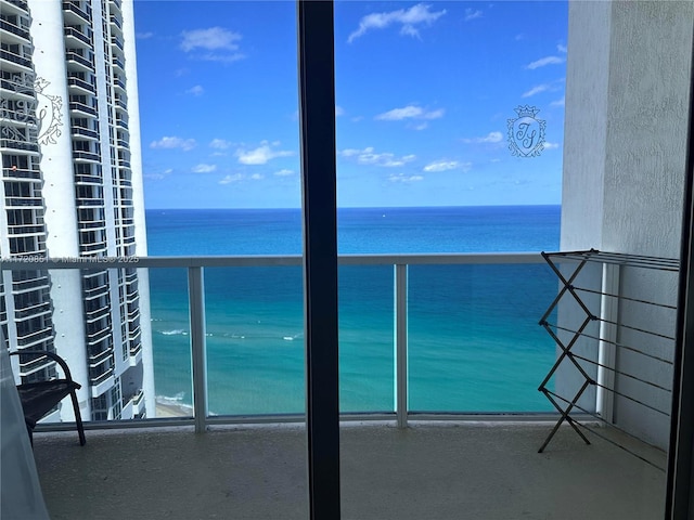 balcony featuring a water view